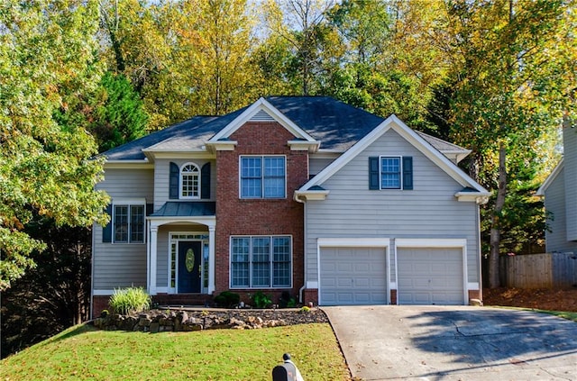 view of front of home featuring a front yard and a garage