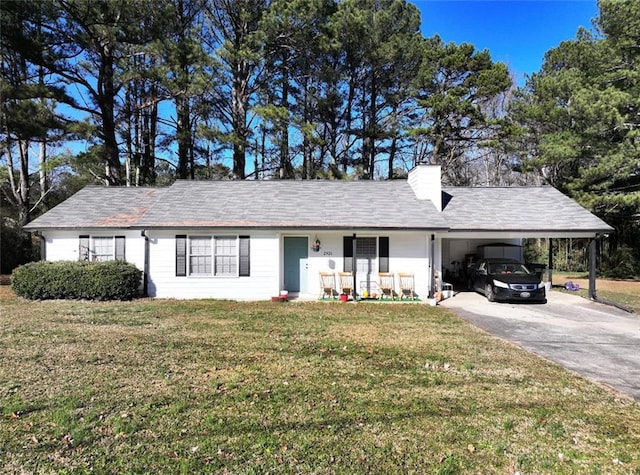 ranch-style house featuring a front yard and a carport