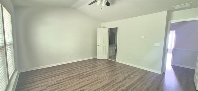2061 Fosco Dr, Duluth, GA 30097 - unfurnished bedroom with dark wood-type flooring, lofted ceiling, baseboards, and a ceiling fan