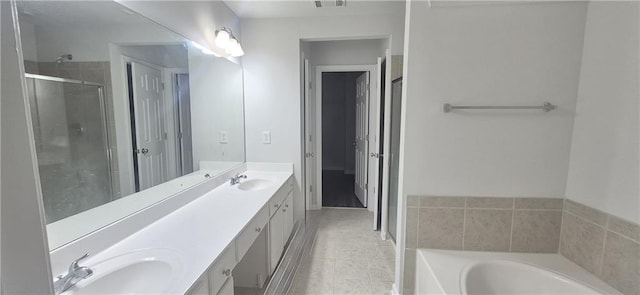 2061 Fosco Dr, Duluth, GA 30097 - full bath featuring double vanity, tile patterned flooring, a garden tub, and a shower stall