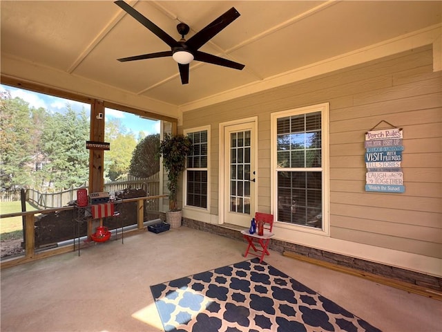 view of patio with a ceiling fan and fence