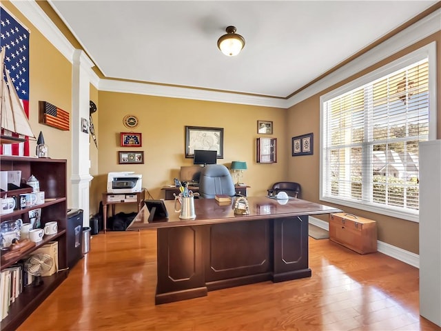 home office with baseboards, ornamental molding, and wood finished floors