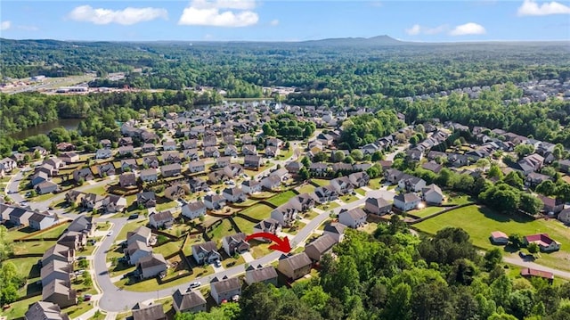 aerial view featuring a residential view and a view of trees