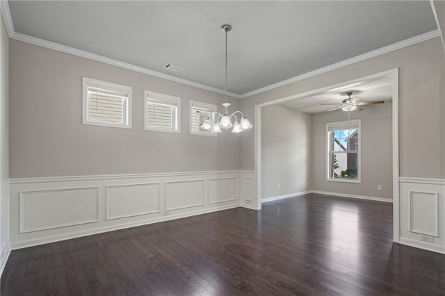 unfurnished dining area with visible vents, ornamental molding, dark wood finished floors, and a wainscoted wall