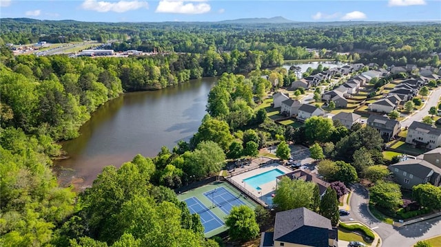 aerial view featuring a water view and a forest view