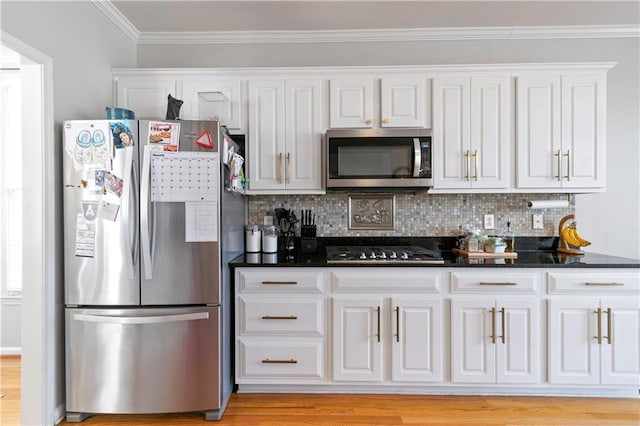325 Stonecastle Pass, South Fulton, GA 30331 - kitchen featuring white cabinetry, stainless steel appliances, backsplash, and crown molding