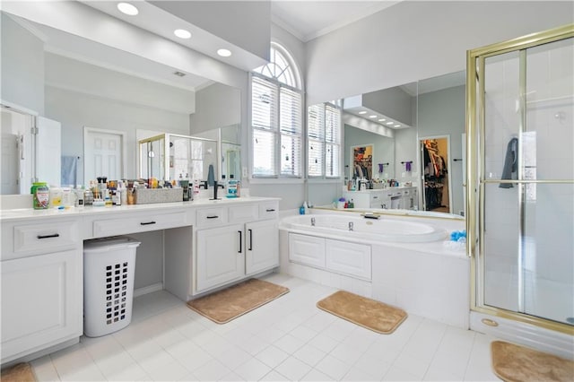 325 Stonecastle Pass, South Fulton, GA 30331 - bathroom featuring a stall shower, tile patterned floors, vanity, a garden tub, and ornamental molding