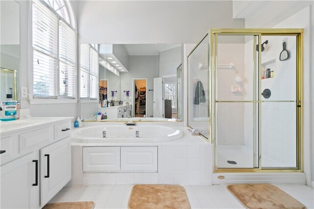 325 Stonecastle Pass, South Fulton, GA 30331 - bathroom featuring a stall shower, tile patterned floors, vanity, and a bath