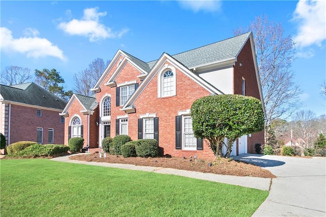 325 Stonecastle Pass, South Fulton, GA 30331 - view of front of house featuring a front lawn, driveway, and brick siding