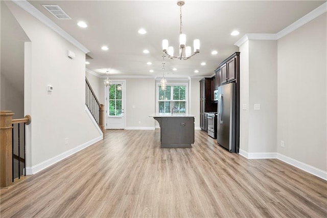 3657 Atherton Park Ct, Suwanee, GA 30024 - kitchen with stainless steel appliances, a chandelier, crown molding, light wood-style flooring, and recessed lighting