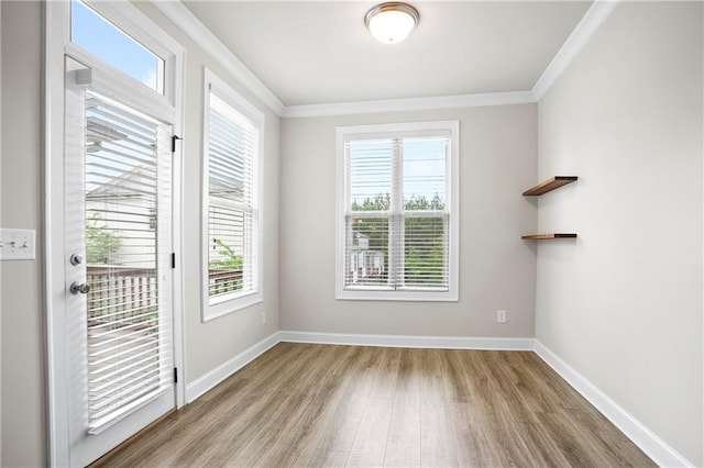 3657 Atherton Park Ct, Suwanee, GA 30024 - spare room featuring crown molding, wood finished floors, and healthy amount of natural light