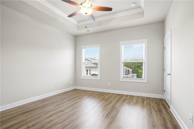 3657 Atherton Park Ct, Suwanee, GA 30024 - spare room featuring a raised ceiling, wood finished floors, ceiling fan, a smoke detector, and crown molding