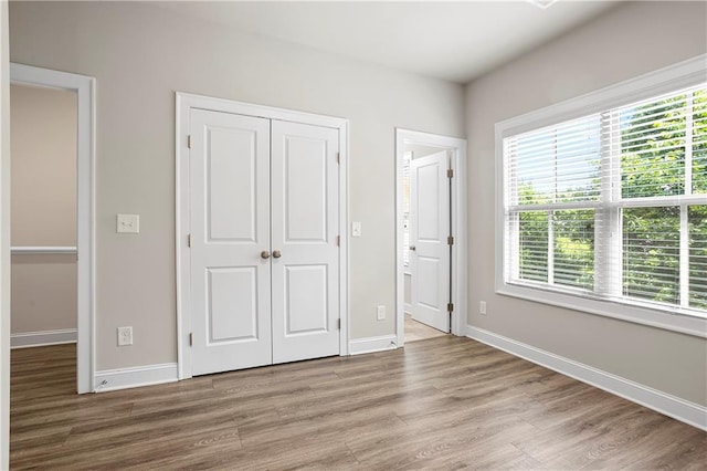 3657 Atherton Park Ct, Suwanee, GA 30024 - unfurnished bedroom featuring wood finished floors and a closet