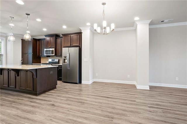 3657 Atherton Park Ct, Suwanee, GA 30024 - kitchen with appliances with stainless steel finishes, ornamental molding, light wood-style floors, dark brown cabinetry, and a chandelier