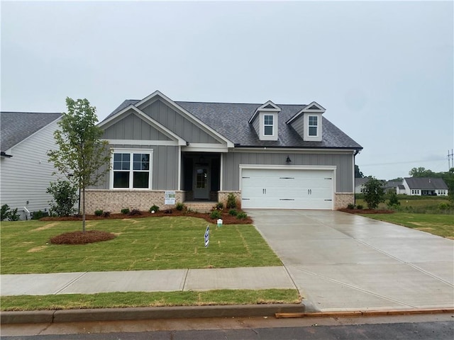 179 Merwood Ln, Jefferson, GA 30549 - craftsman inspired home featuring board and batten siding, an attached garage, a front lawn, and driveway