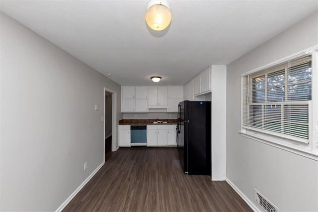 1338 Georgia Ave, Atlanta, GA 30344 - kitchen featuring freestanding refrigerator, dishwasher, dark wood-style flooring, and white cabinets