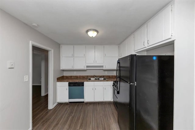 1338 Georgia Ave, Atlanta, GA 30344 - kitchen featuring dishwashing machine, freestanding refrigerator, dark countertops, white cabinets, and dark wood-style floors