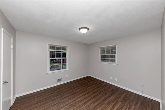 1338 Georgia Ave, Atlanta, GA 30344 - unfurnished room featuring wood finished floors and a textured ceiling