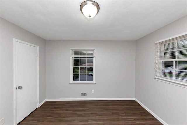 1338 Georgia Ave, Atlanta, GA 30344 - spare room with plenty of natural light and dark wood-style flooring