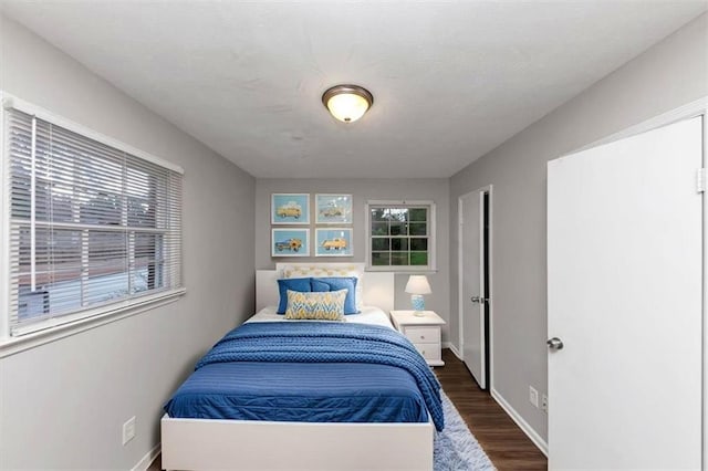 1338 Georgia Ave, Atlanta, GA 30344 - bedroom featuring dark wood finished floors and baseboards