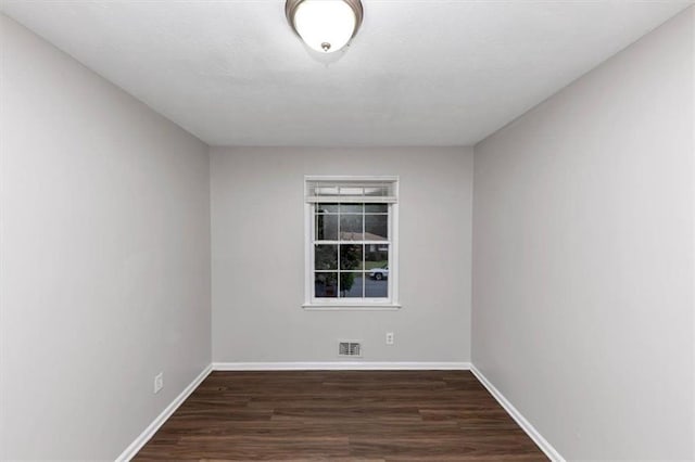 1338 Georgia Ave, Atlanta, GA 30344 - empty room featuring dark wood-style floors and baseboards