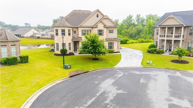 6390 Yellow Birch St, Cumming, GA 30040 - view of front facade with a water view, a front lawn, and driveway