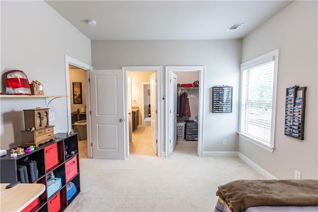 6390 Yellow Birch St, Cumming, GA 30040 - bedroom with light colored carpet, a walk in closet, a closet, and baseboards