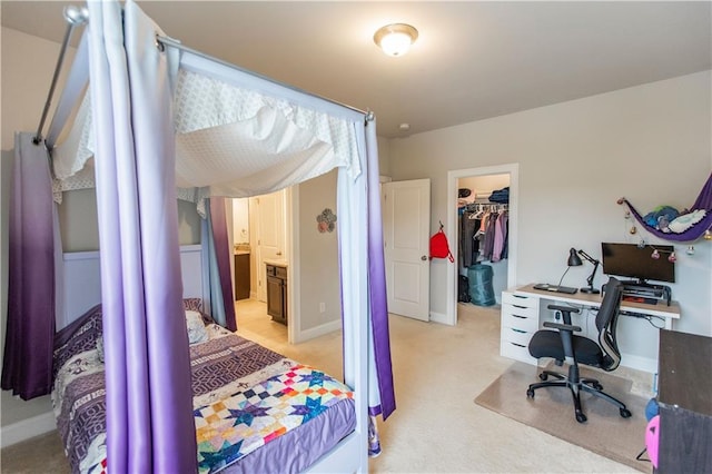 6390 Yellow Birch St, Cumming, GA 30040 - bedroom with a walk in closet, a closet, light colored carpet, and baseboards