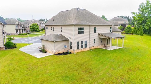 6390 Yellow Birch St, Cumming, GA 30040 - back of house with a lawn, a patio area, a shingled roof, and a residential view