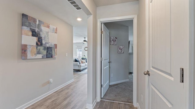 hallway featuring wood-type flooring