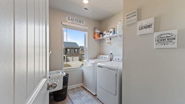 washroom featuring light hardwood / wood-style flooring and independent washer and dryer