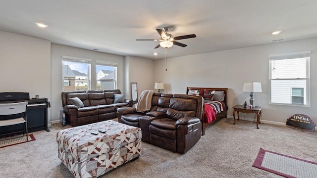 bedroom with light carpet and ceiling fan