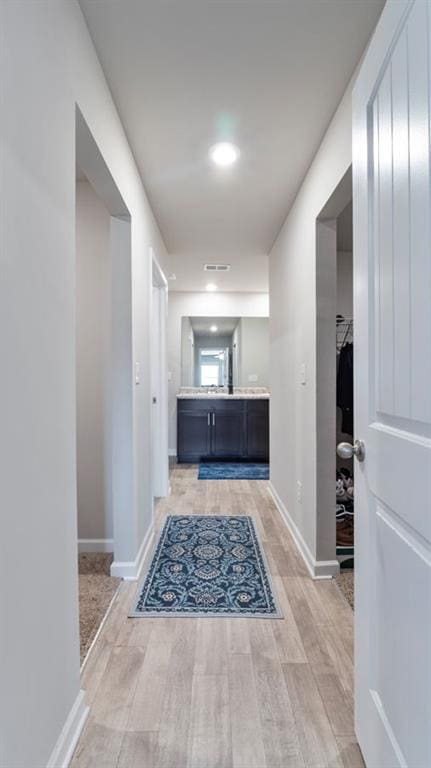 hallway with light wood-type flooring