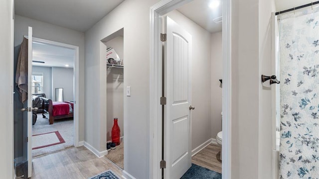 hallway featuring light hardwood / wood-style flooring