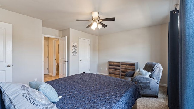 bedroom with ceiling fan and light carpet