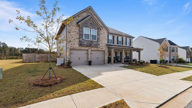 view of front of property featuring a garage and a front yard