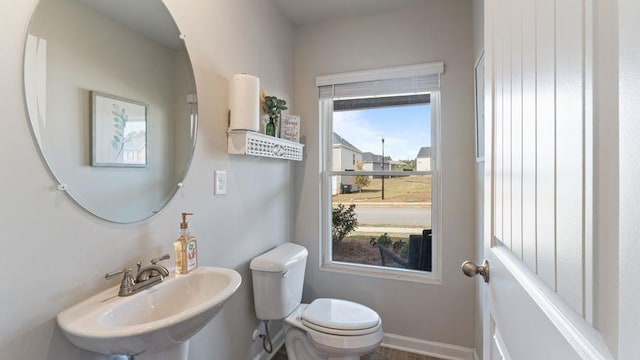 bathroom with toilet and sink