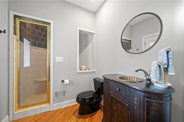 19 Spring Lake Trl NE, White, GA 30184 - full bath featuring toilet, a shower stall, vanity, wood finished floors, and baseboards