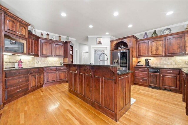 19 Spring Lake Trl NE, White, GA 30184 - kitchen with stainless steel fridge, crown molding, a kitchen bar, light wood finished floors, and tasteful backsplash