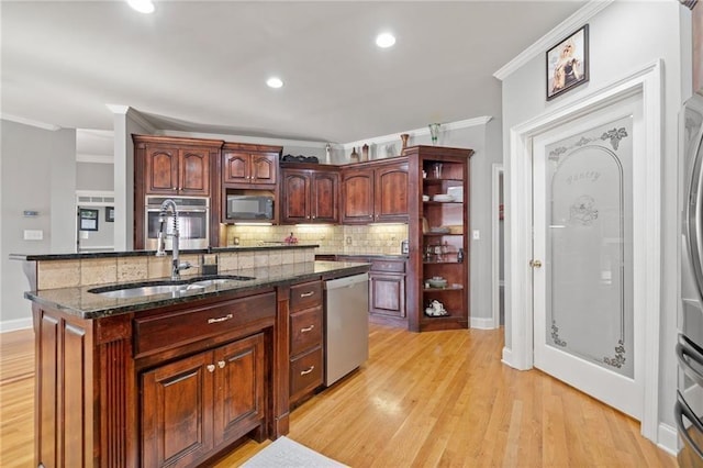 19 Spring Lake Trl NE, White, GA 30184 - kitchen featuring appliances with stainless steel finishes, a sink, crown molding, tasteful backsplash, and light wood finished floors