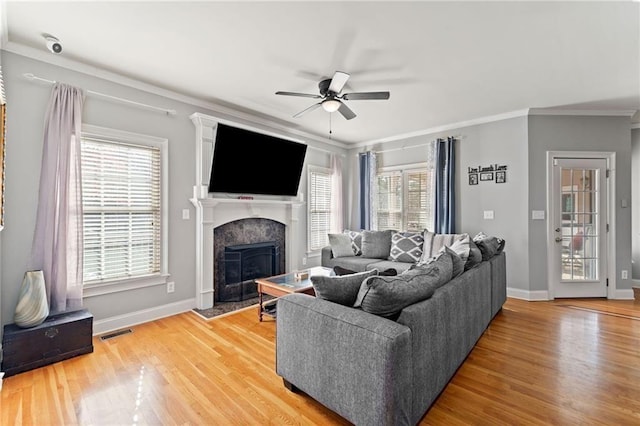 19 Spring Lake Trl NE, White, GA 30184 - living room featuring a ceiling fan, a high end fireplace, ornamental molding, light wood-style flooring, and baseboards