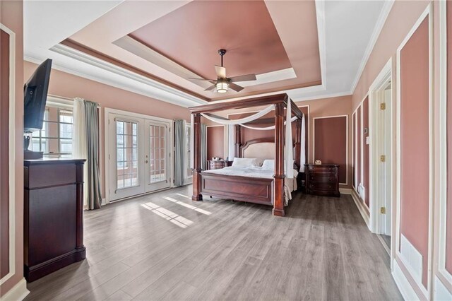 19 Spring Lake Trl NE, White, GA 30184 - bedroom featuring a tray ceiling, french doors, access to outside, wood finished floors, and crown molding