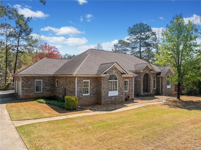 19 Spring Lake Trl NE, White, GA 30184 - view of front of home featuring a front lawn, brick siding, roof with shingles, and driveway