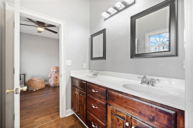 19 Spring Lake Trl NE, White, GA 30184 - bathroom with double vanity, wood finished floors, baseboards, and ceiling fan