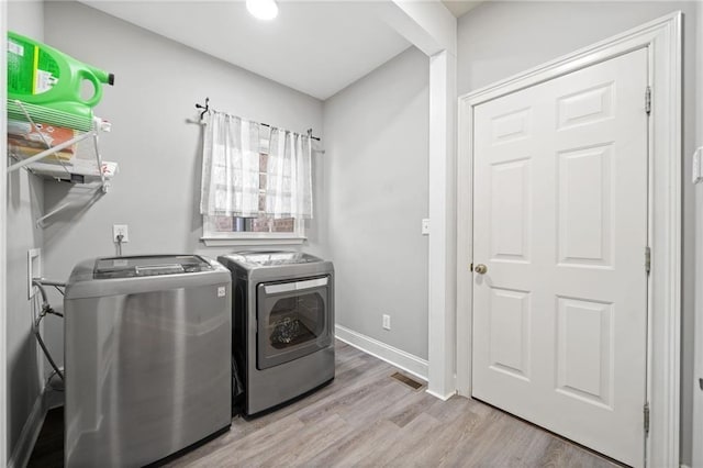 19 Spring Lake Trl NE, White, GA 30184 - laundry area featuring washing machine and clothes dryer, wood finished floors, and baseboards