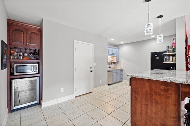 19 Spring Lake Trl NE, White, GA 30184 - kitchen featuring stainless steel appliances, recessed lighting, light tile patterned floors, a sink, and light stone counters