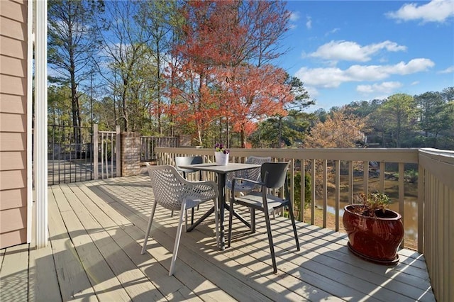 19 Spring Lake Trl NE, White, GA 30184 - wooden terrace featuring outdoor dining space and view of wooded area