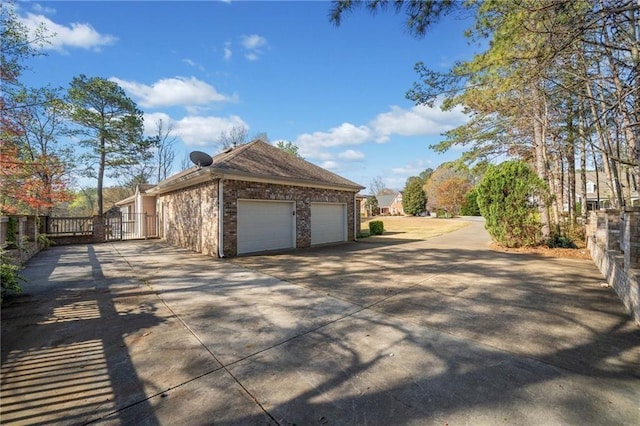 19 Spring Lake Trl NE, White, GA 30184 - view of side of property featuring concrete driveway, brick siding, and a garage