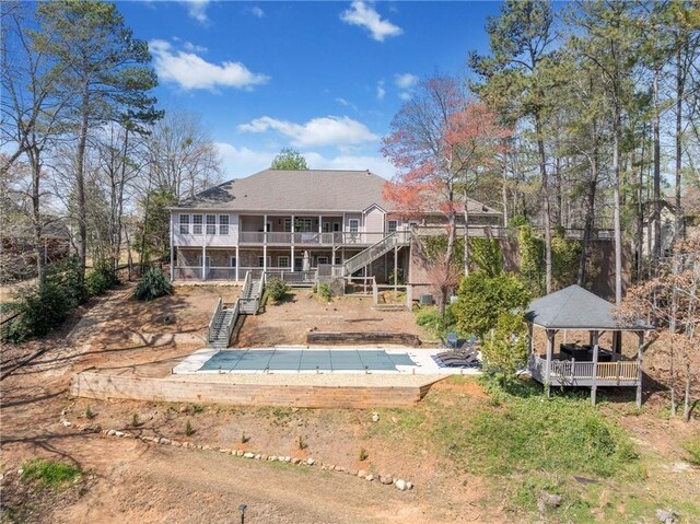 19 Spring Lake Trl NE, White, GA 30184 - rear view of house with stairs, a gazebo, and a covered pool