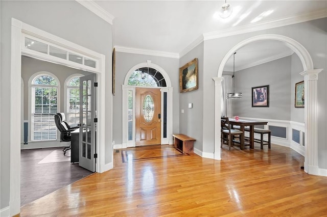 19 Spring Lake Trl NE, White, GA 30184 - foyer featuring wood finished floors, ornamental molding, and arched walkways